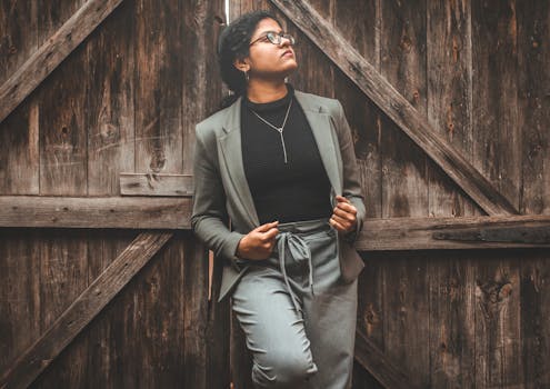 young professional woman wearing enamel jewelry